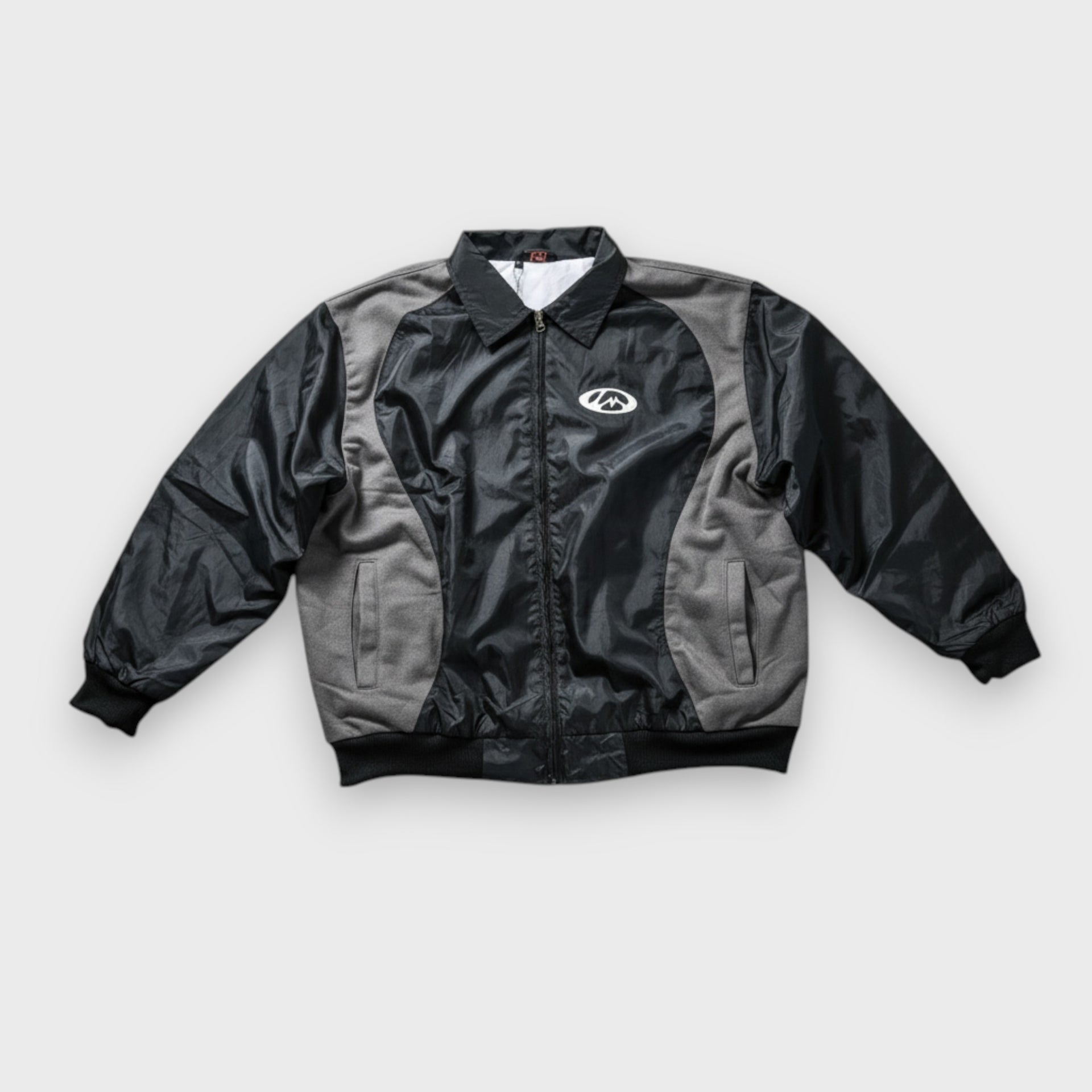 Molino black warm-up jacket front view nylon shell